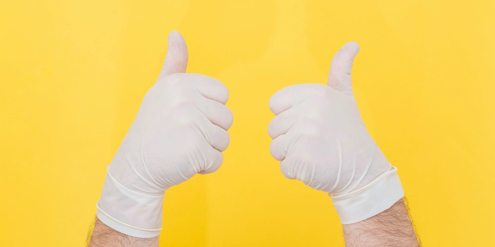 two hands with their thumbs up for autogenous bone grafting